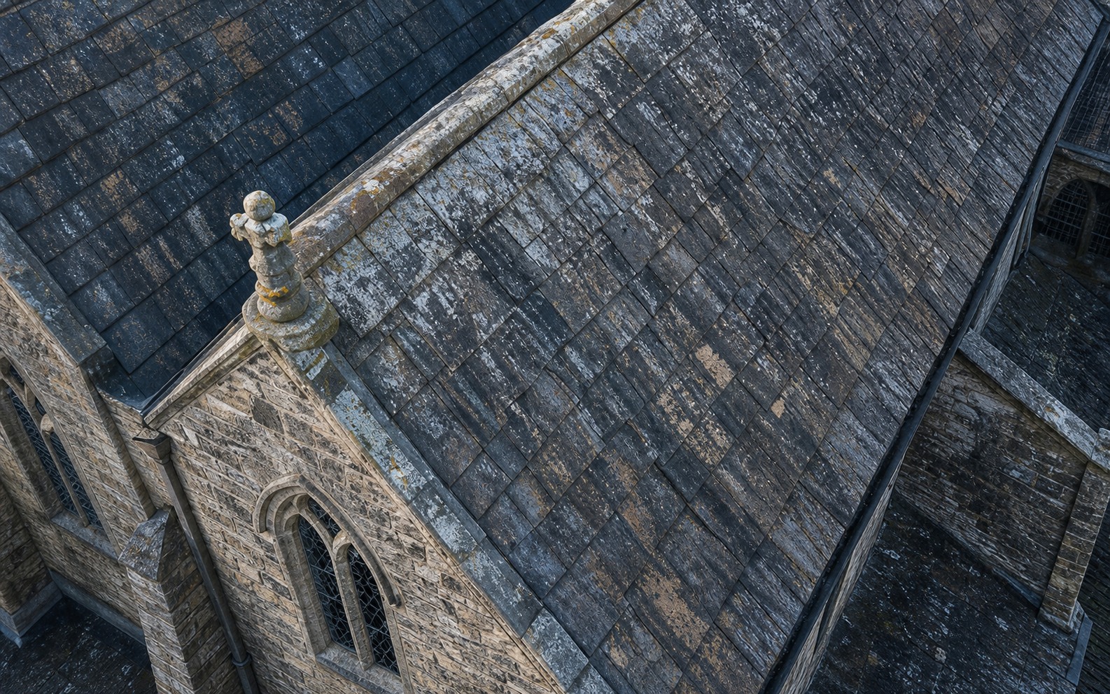 Close aerial inspection of historic roof tiles